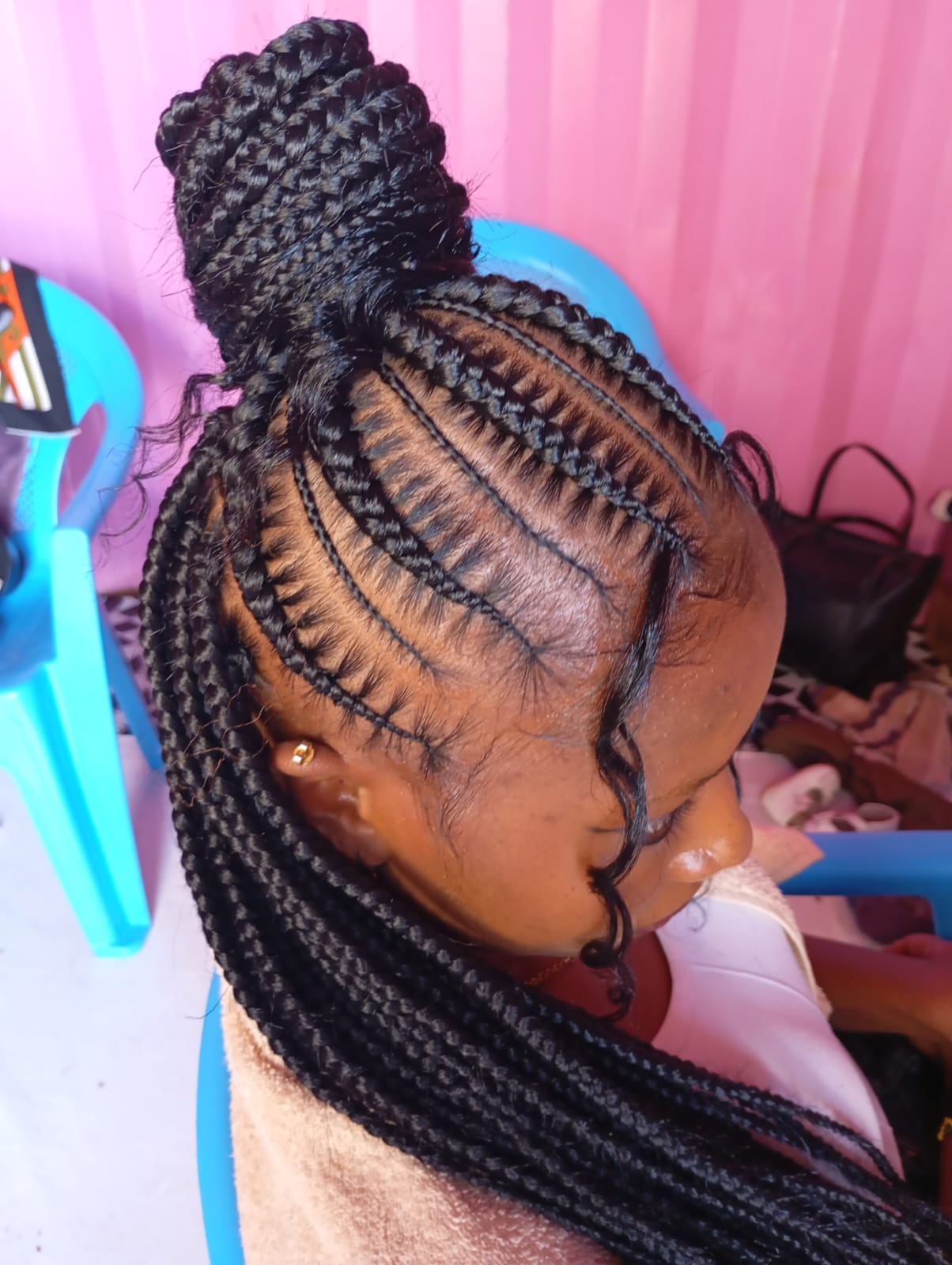 Neat stitches hairstyle by Blessed Rayna Salon